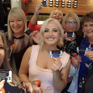 A group of happy people who have been entertained by Darren Brand